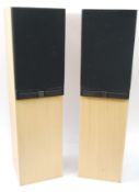 A pair of Mordaunt Short - Music Series 25i speakers set within oak pedestal cases.