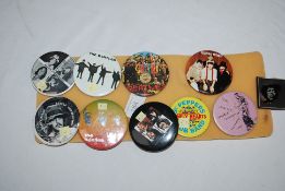 A collection of Pop and Rock music badges to include several Beatles and a couple of Jimi Hendrix.