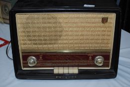 Vintage Philip's Bakelite cased valve radio, dials and switches to front.