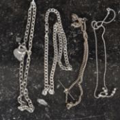 A silver necklace with bar and heart pen