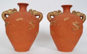 A pair of 20th century terracotta amphor