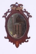 A Victorian mahogany inlaid carved oval