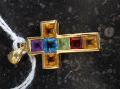An 18ct gold multi coloured stone crucif