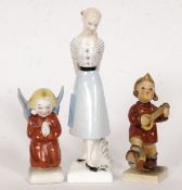 Two Hummel china figurines, along with a