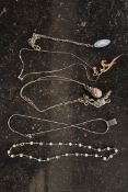 A collection of 6 silver chains and pend