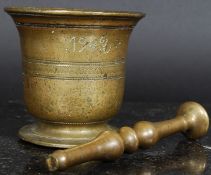 A 19th century bronze pestle and mortar,