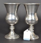 A pair of silver hallmarked wine vessels