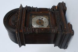 An ebonised oak cased Junghans mantle cl