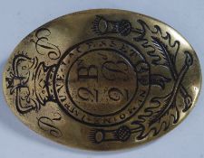 A BRASS CROSS BELT PLATE of the 2nd Batt