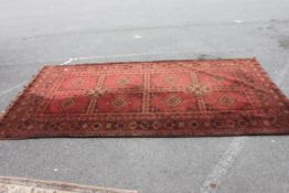 A 20th century Persian style rug having