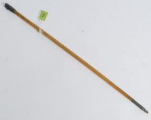 A Chinese 19th century silver topped rhino horn swagger stick The tapered rhino horn stem having