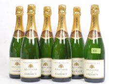 A case of Antoine De Clevecy French Champagne being laid down still in the original box