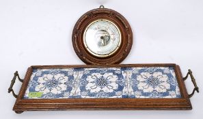 A Victorian oak and blue and white tiled brass handled butlers tray together with a brass aneroid