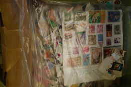A large box of stamps - kiloware to include many foreign examples etc.