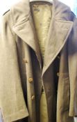 A 2nd World War American great coat having lined interior with clover army patch emblem to arm
