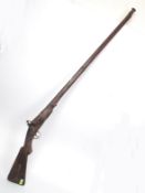 An 18th / 19th century Anglo - Indian Bandaq Matchlock musket The long heavy cast iron barrel being