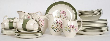 A vintage Bristol ( Poutney ) chintz pattern part dinner / tea service comprising cups, saucers,