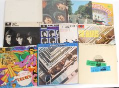 A collection of vinyl LP / Long Play records by The Beatles to include The White Album,