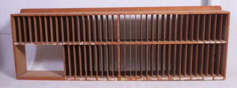 A large  vintage 1950's Industrial pigeon hole stationary cabinet having plain sides with fitment