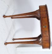 A Victorian occasional table / desk of oval form raised on with inset leather worked scribe raised