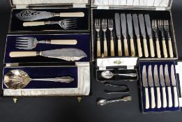 A collection of cased flatwares to include fish services, knives,