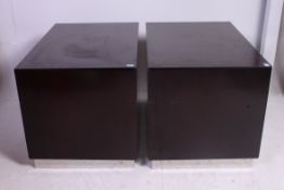 A pair of laquered rosewood / teak and chrome pedestals.