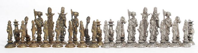 A decorative 20th century brass chess set of Chinese origin,