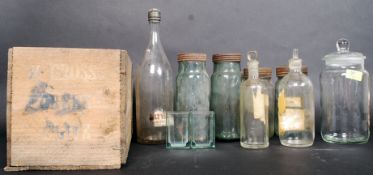 A collection of glassware to include vintage bottles,