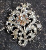 A 19th century silver and gold ladies brooch and chain.