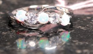 A white metal silver five stone cz and opalite ring Size R