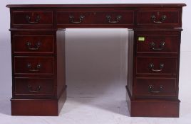 A Georgian style mahogany twin pedestal office desk.