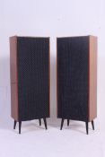 A pair of stunning 1960's tall pedestal laquered teak wood hi-fi speakers raised on ebonised