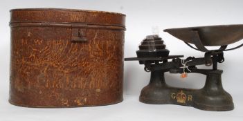 A set of vintage cast iron grocers - industrial scales bearing GR royal cipher together with a