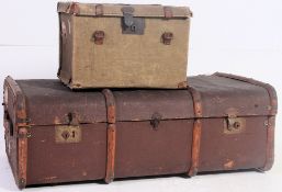 A vintage 20th century wooden and canvas bound steamer trunk together with a green canvas de-mob