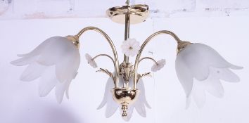 A contemporary 3 branch gilded metal chandelier and matching wall lights complete with the matching