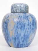 A Ruskin Pottery style drip glaze lustre  ginger jar and lid in blue and purples.