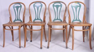 A set of 4 Thonet Bentwood style beech wood cafe chairs having painted decorative back rests over
