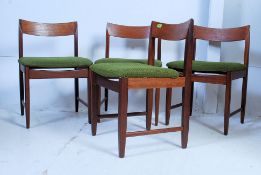 A set of 4 1970's Danish solid teak wood propeller back dining chairs.
