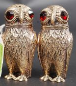 A pair of antique style owl condiments with inset red glass eyes - each stamped 800 (indicating