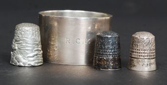 A silver hallmarked napkin ring complete in the original leather presentation case, initialled R.C.