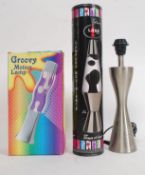 A collection of lamps to include boxed Lava lamps and a brushed aluminium lamp H47cm