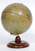 A vintage desk top globe raised on wooden plinth. The globe marked for Politischer Erdglobus.
