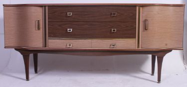 A 1960's faux wood formica sideboard having laquered finish raised on angled legs with a series of