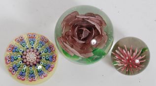 A 20th century Perthshire millefiori cane paperweight having inset P to centre together with 2