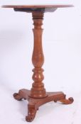 A 19th century Victorian elm wood tilt top tripod wine table.