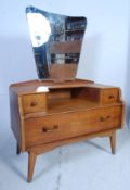 A 1950's oak Ernest Gomme / G-Plan  dressing table chest having shaped mirrors over drawers all