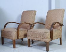 A pair of 1930's Art Deco bridge armchairs having bentwood shaped elbow rests with upholstered