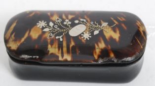 A papier mache and tortoiseshell silver inlaid snuff box with hinged top having decorative silver