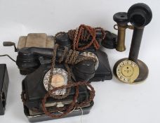 A collection of vintage telephones to include candlestick phone,