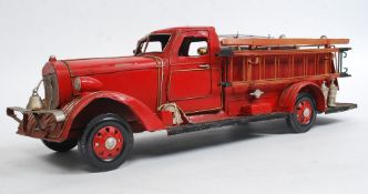 A 20th century tinplate model of a fire engine 56cm long